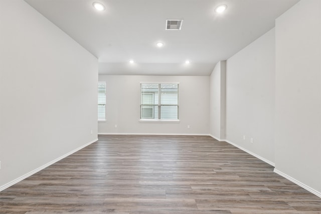 spare room with hardwood / wood-style flooring