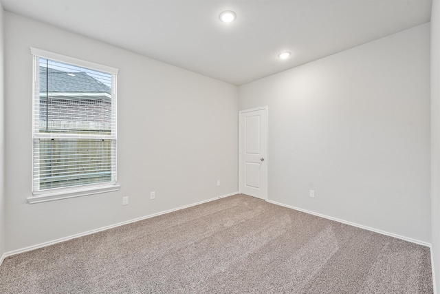 unfurnished room with carpet floors