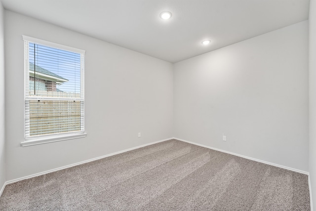 unfurnished room with carpet flooring