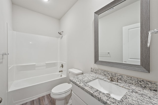 full bathroom with vanity, toilet, wood-type flooring, and shower / tub combination