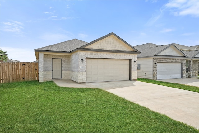 ranch-style home featuring a front lawn and a garage