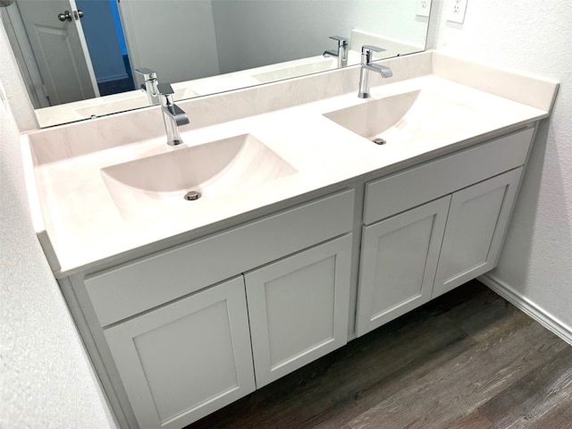 bathroom featuring vanity and wood-type flooring