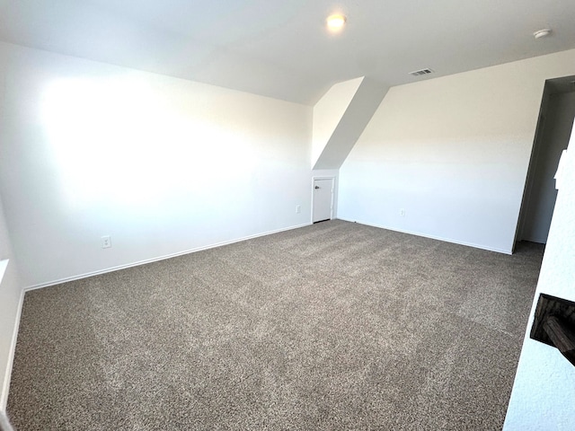 additional living space featuring carpet flooring