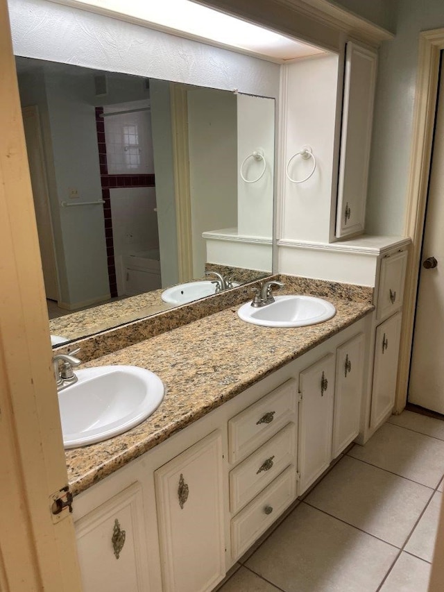 bathroom with vanity and tile patterned floors