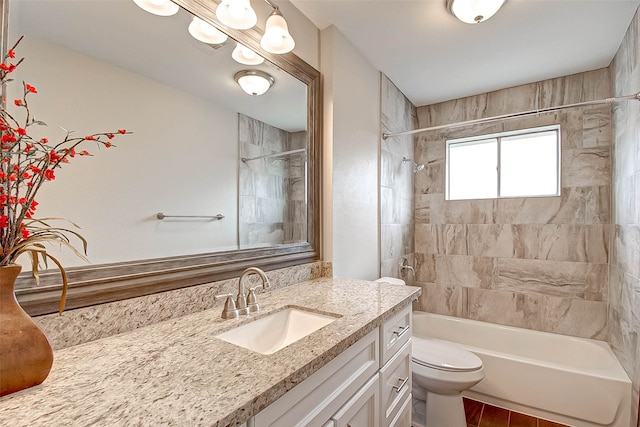 full bathroom with vanity, toilet, and tiled shower / bath combo