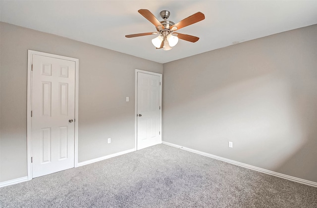 empty room with carpet floors and ceiling fan