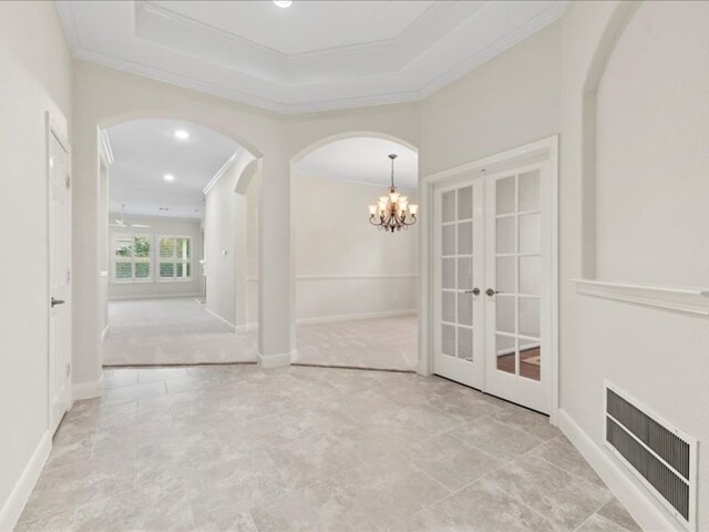 9410 Trinity Trail Ct, Cypress, TX 77433 - empty room featuring ornamental molding, arched walkways, french doors, a chandelier, and recessed lighting