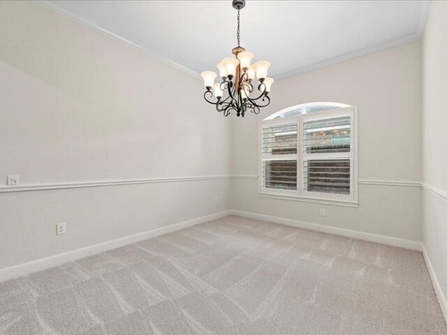9410 Trinity Trail Ct, Cypress, TX 77433 - spare room with a chandelier, baseboards, ornamental molding, and light carpet
