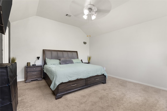 carpeted bedroom with vaulted ceiling and ceiling fan