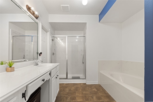 bathroom featuring vanity and plus walk in shower