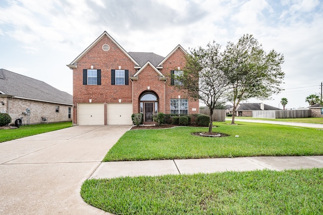 view of front property featuring a front yard and a garage