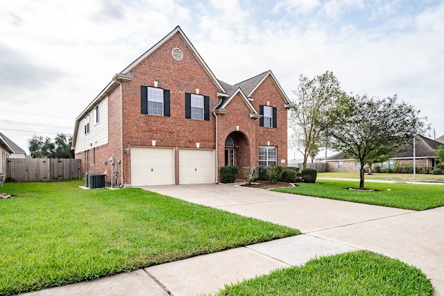 front facade with a front lawn and a garage