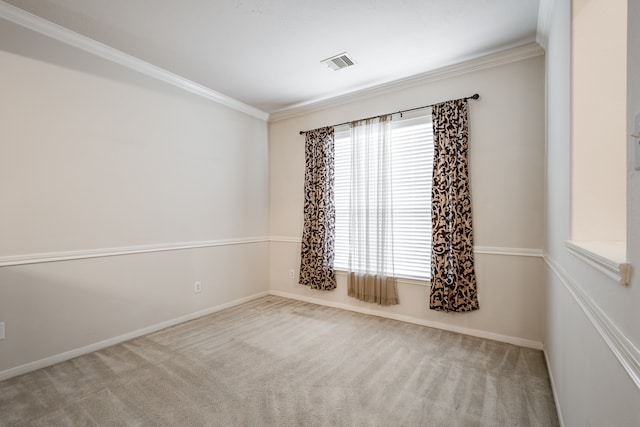 carpeted spare room featuring crown molding