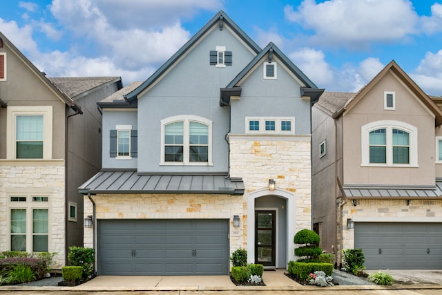 townhome / multi-family property featuring a garage