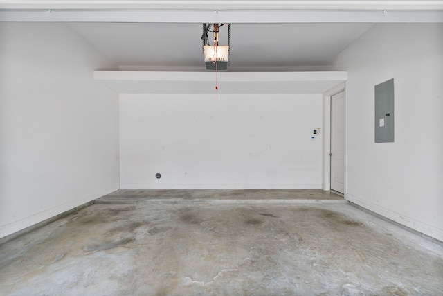 garage with electric panel and a garage door opener