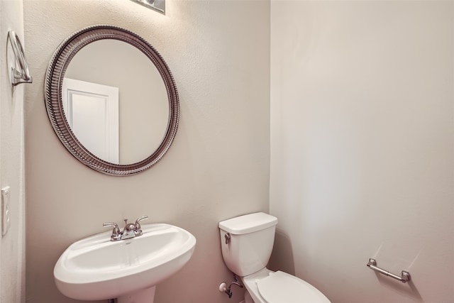 bathroom with toilet and sink