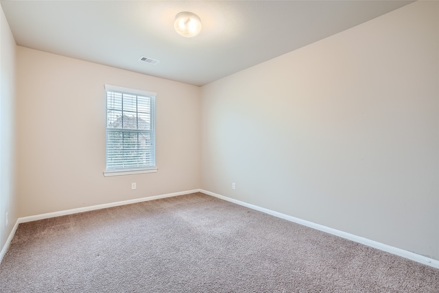 spare room featuring carpet flooring