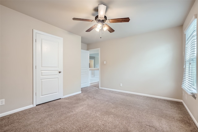 unfurnished bedroom with carpet flooring and ceiling fan