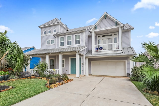 view of front of property with a garage, a porch, a front yard, and a balcony