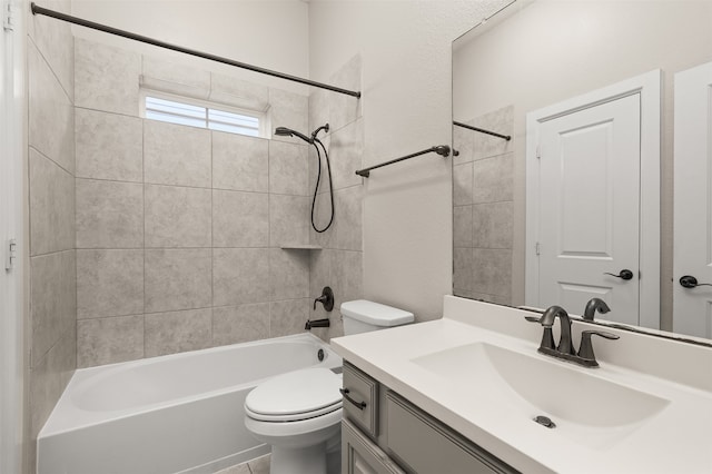 full bathroom featuring vanity, toilet, and tiled shower / bath