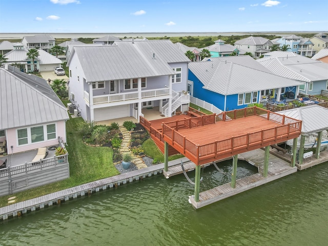 aerial view featuring a residential view and a water view