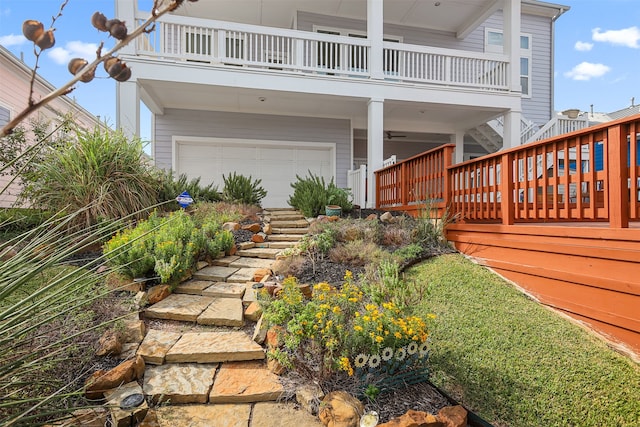 view of yard featuring a deck and a garage