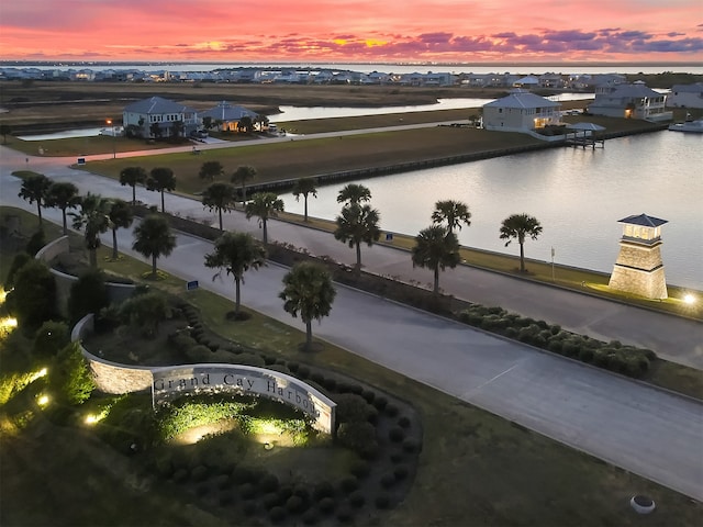 aerial view at dusk with a water view