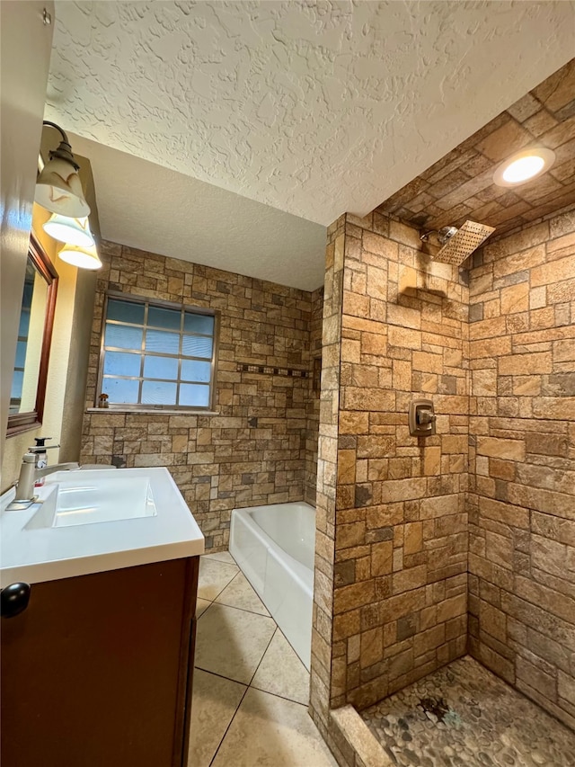 bathroom featuring vanity, plus walk in shower, a textured ceiling, and tile patterned floors