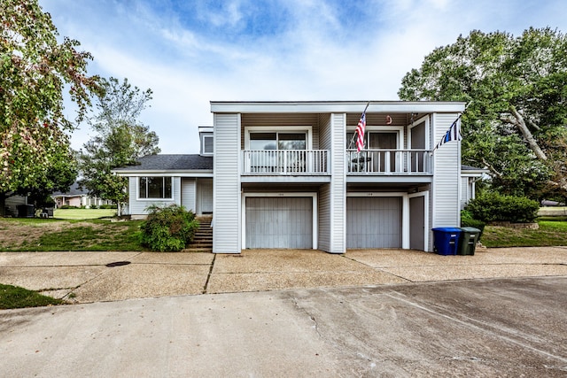 view of front of house with a front yard and a garage