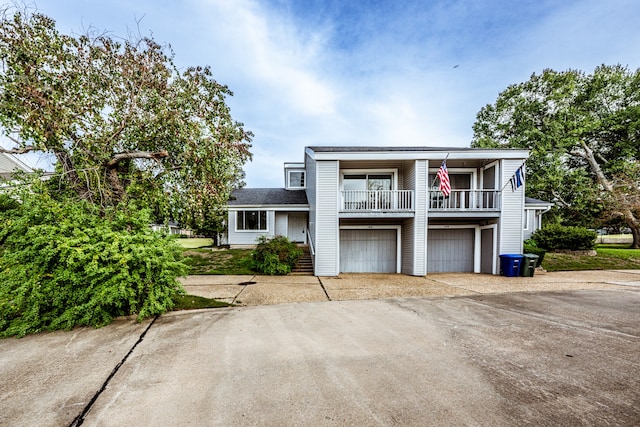 view of front of house with a porch and a garage