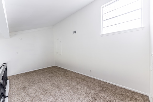 unfurnished room featuring carpet