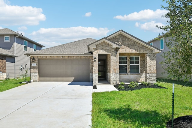 view of front facade featuring a garage and a front lawn