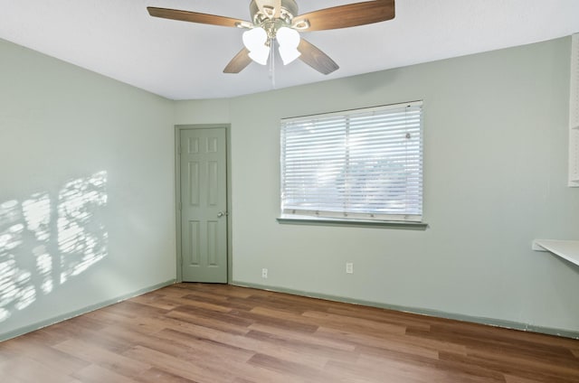 spare room with ceiling fan and light hardwood / wood-style floors