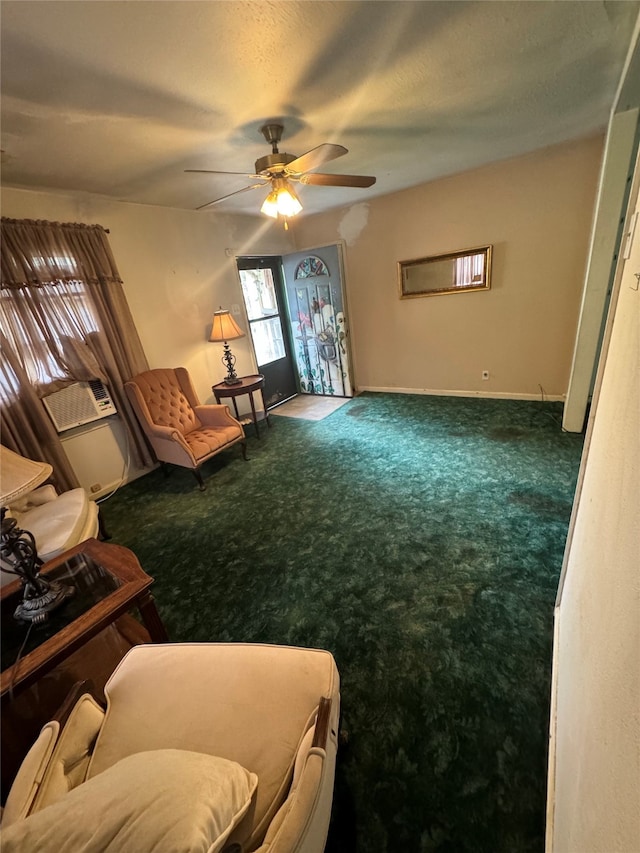 sitting room with a textured ceiling, ceiling fan, and carpet floors