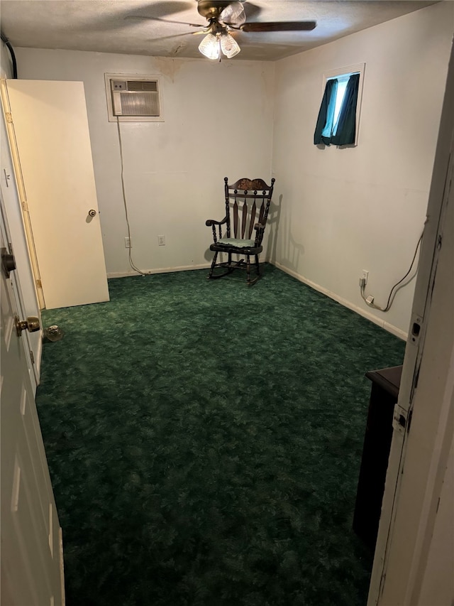 unfurnished room featuring a textured ceiling, an AC wall unit, ceiling fan, and dark carpet