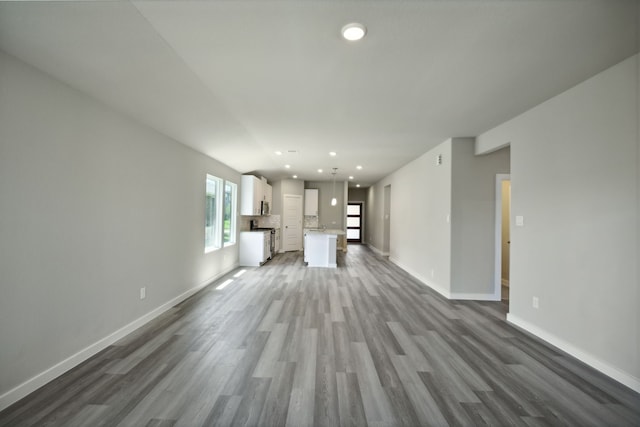 unfurnished living room featuring dark hardwood / wood-style floors