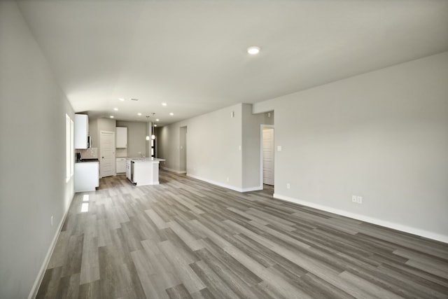 unfurnished living room with light hardwood / wood-style floors