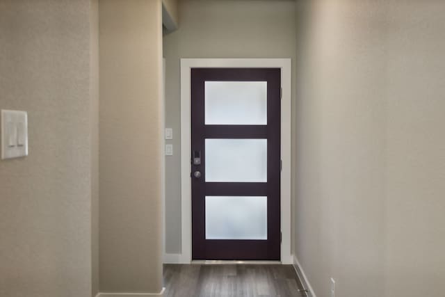 doorway to outside with hardwood / wood-style floors