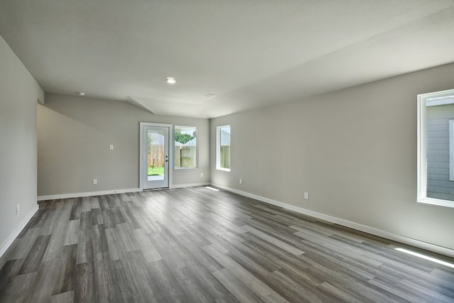 spare room featuring dark hardwood / wood-style flooring