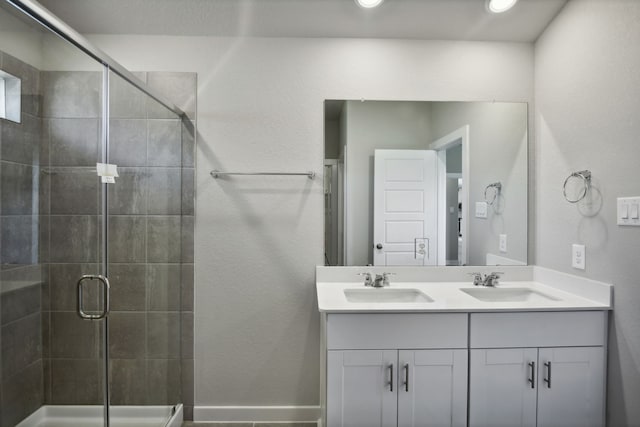 bathroom featuring vanity and an enclosed shower