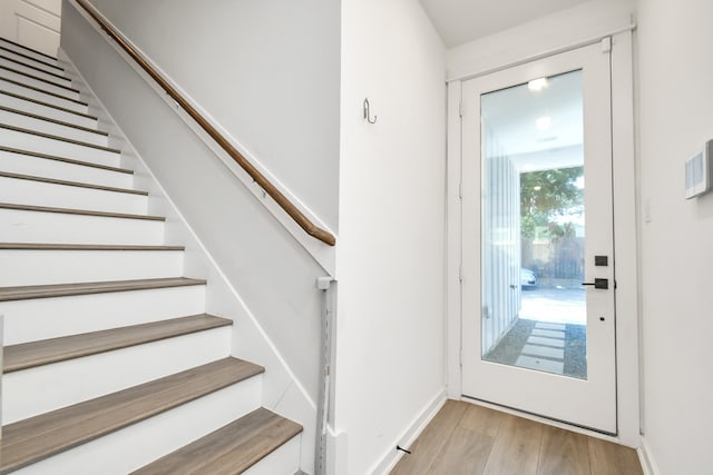 doorway with light wood-type flooring