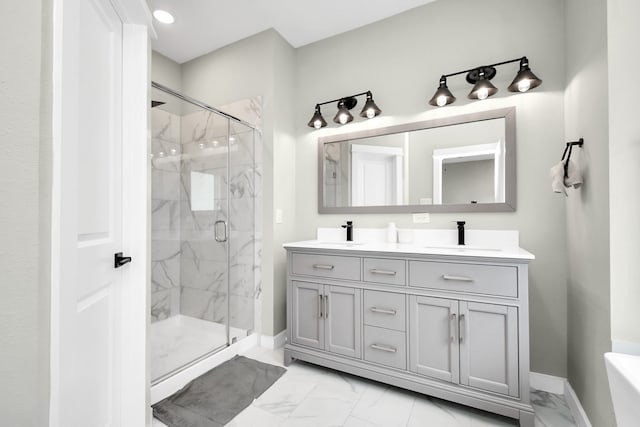 bathroom featuring walk in shower and vanity