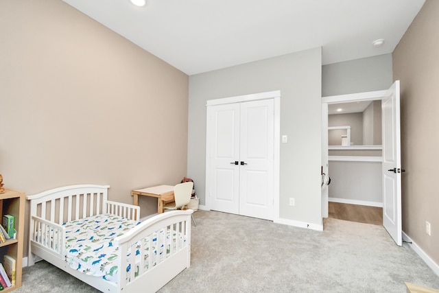 carpeted bedroom with a closet