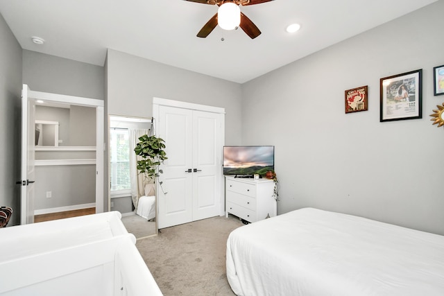 carpeted bedroom featuring ceiling fan