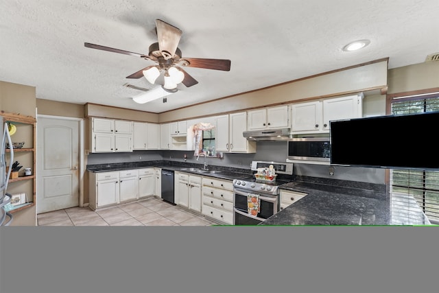 kitchen featuring stainless steel appliances, sink, plenty of natural light, and white cabinets