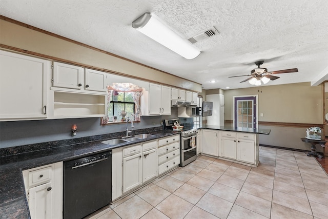 kitchen with sink, dishwasher, white cabinets, and range with two ovens