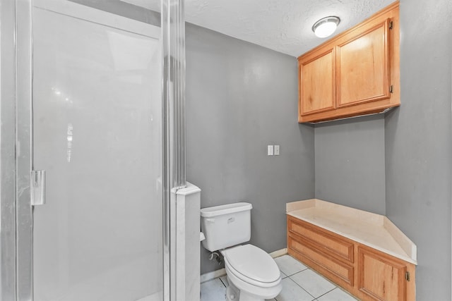 bathroom with toilet, a textured ceiling, walk in shower, and tile patterned flooring