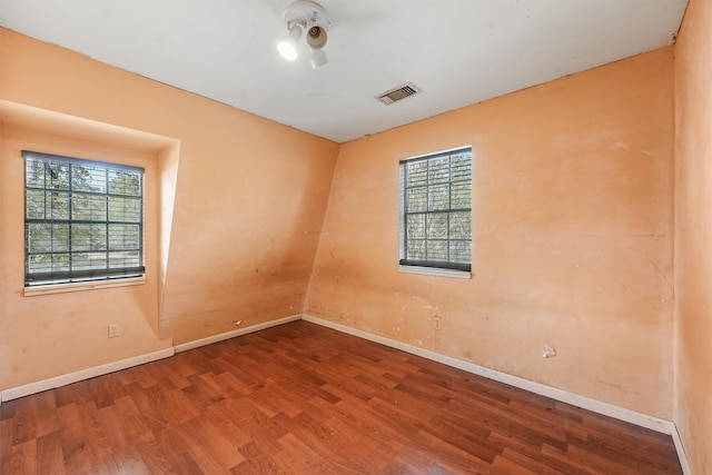 spare room featuring hardwood / wood-style floors