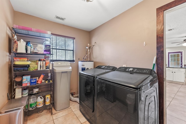 washroom featuring light tile patterned flooring, washer and dryer, and ceiling fan