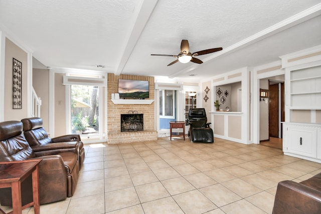 living room featuring a textured ceiling, light tile patterned flooring, and built in features